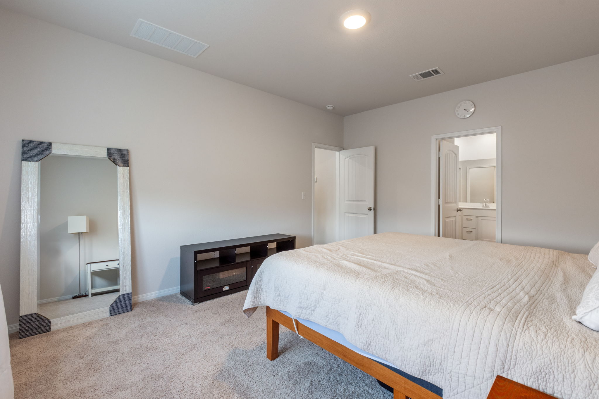 205 Charles Trail Georgetown, TX 78626 - Photo 25 of 36 Bedroom featuring carpet floors and ensuite bathroom