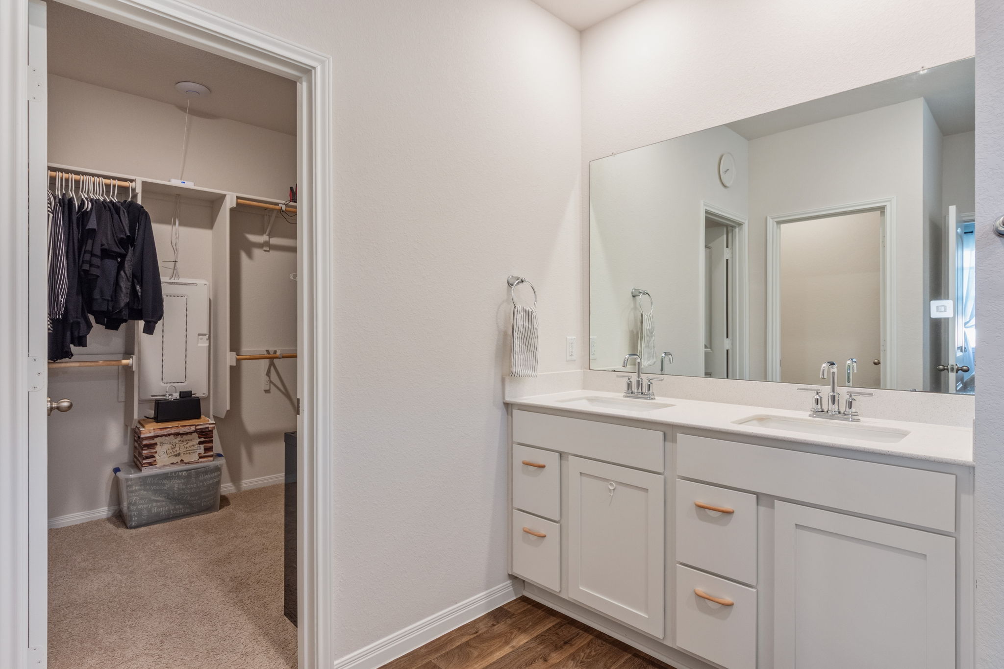 205 Charles Trail Georgetown, TX 78626 - Photo 26 of 36 Full bathroom with double vanity, a spacious closet, and dark wood-style floors