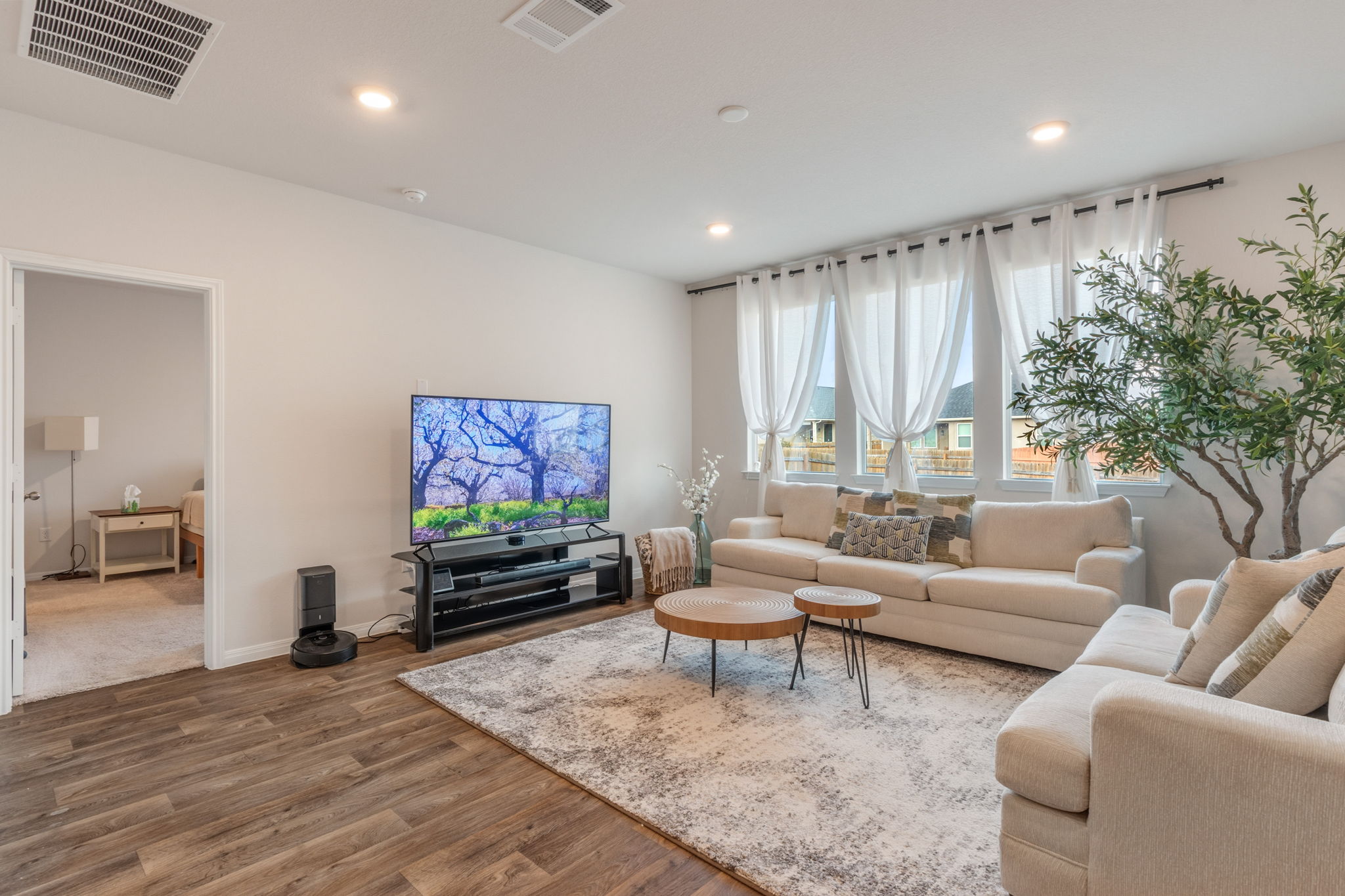 205 Charles Trail Georgetown, TX 78626 - Photo 3 of 36 Living area featuring wood finished floors and recessed lighting