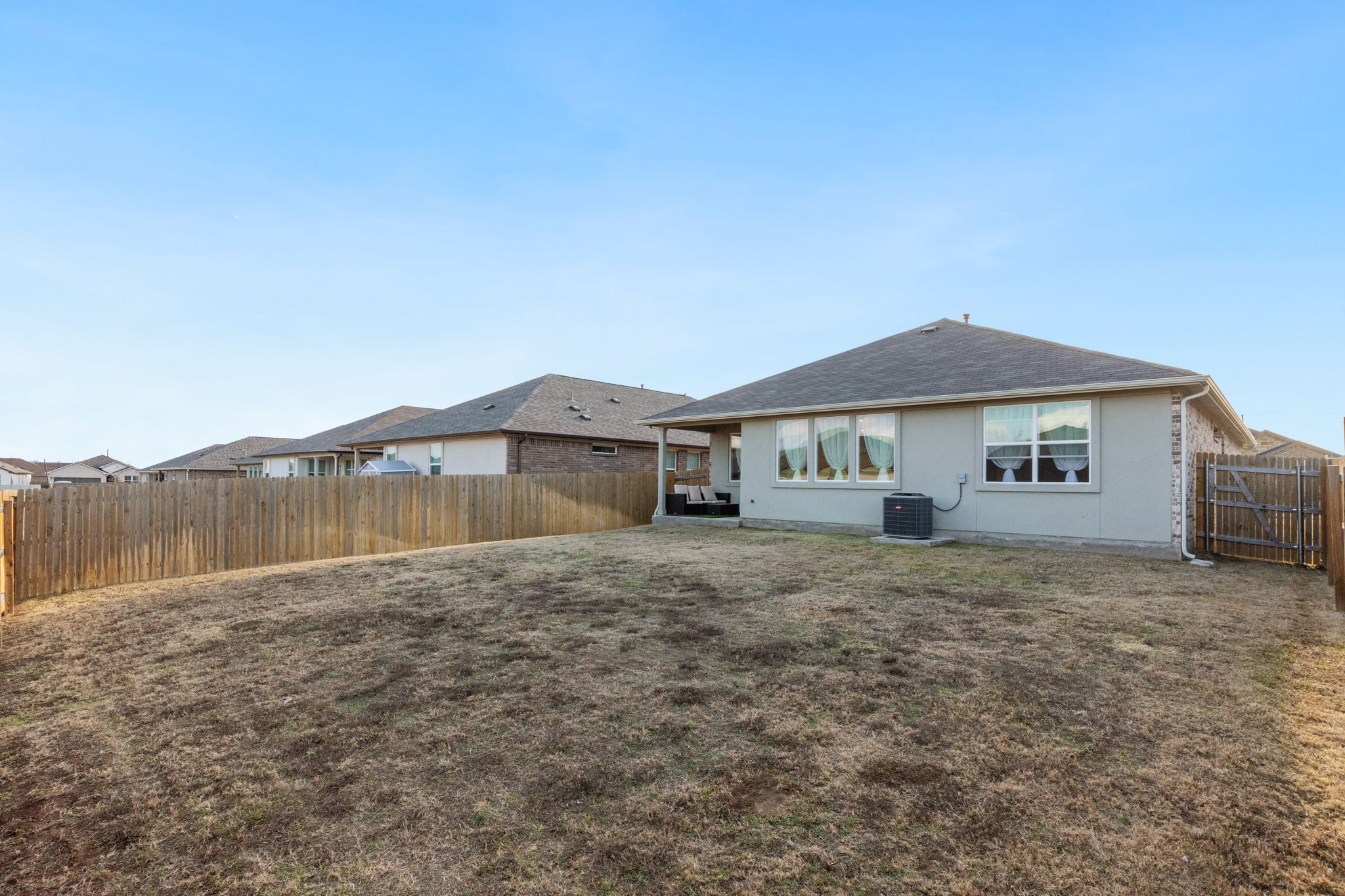 205 Charles Trail Georgetown, TX 78626 - Photo 32 of 36 Back of property featuring a fenced backyard and a patio area