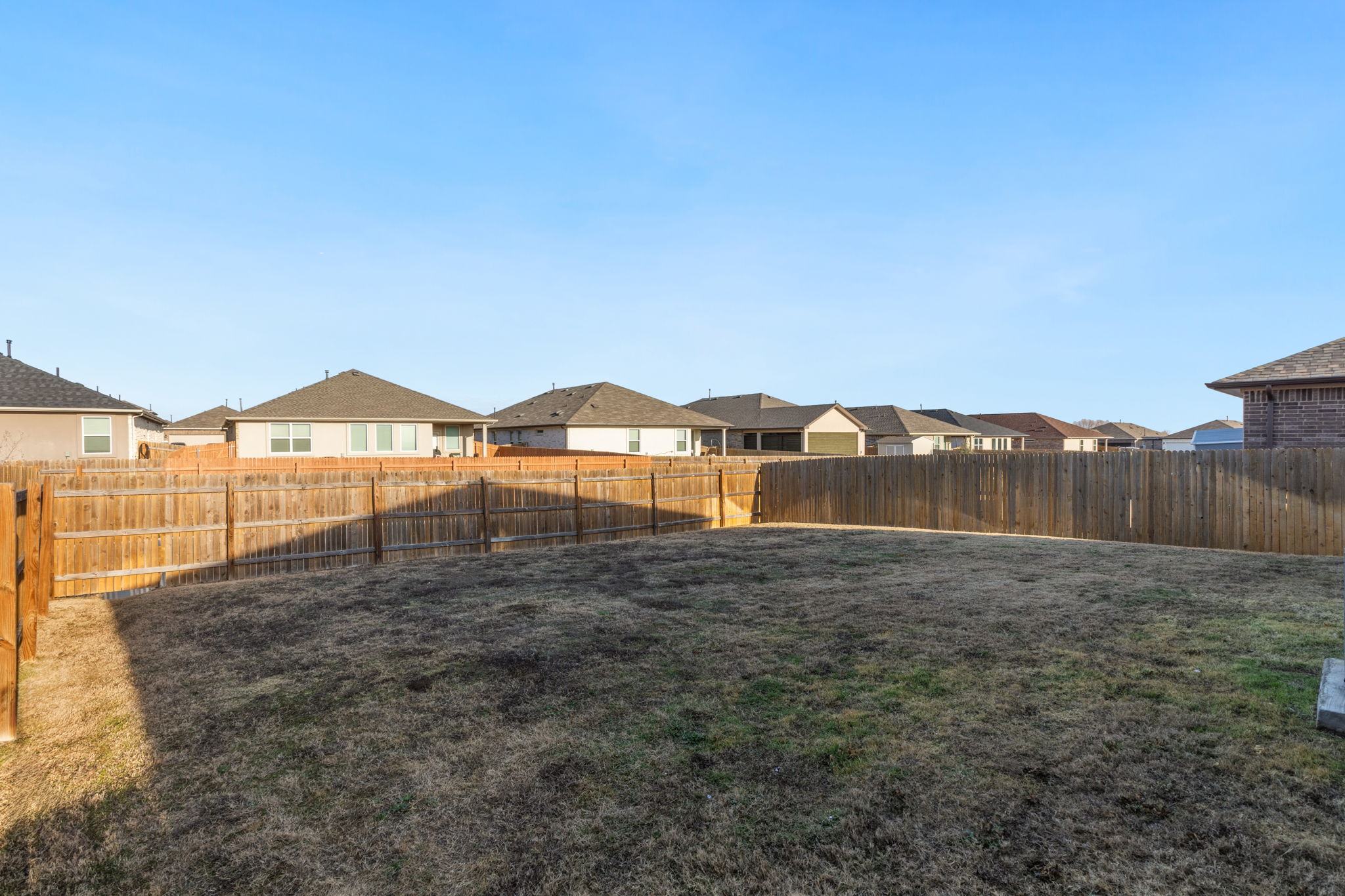 205 Charles Trail Georgetown, TX 78626 - Photo 33 of 36 Fenced backyard with a residential view