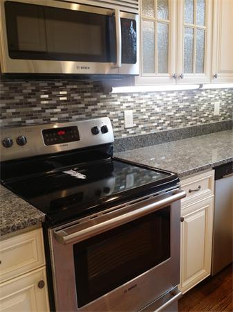 19 Parker Road Newton, MA 02459 - Photo 4 of 24 a stove top oven sitting inside of a kitchen