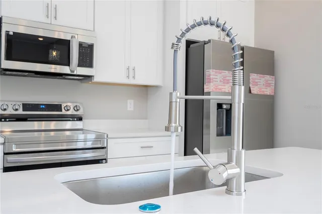 a bathroom with a shower and a sink
