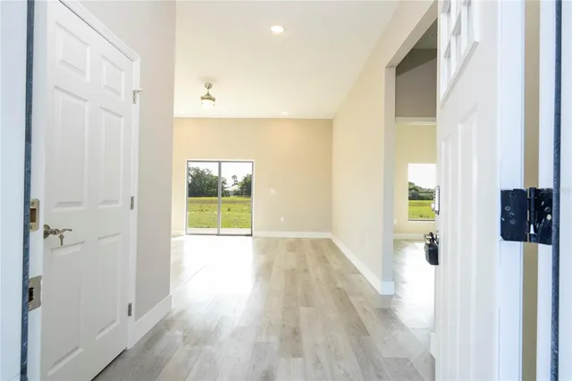 wooden floor with white walls