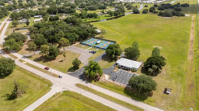 an aerial view of a swimming pool with outdoor space
