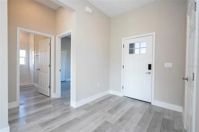 a bathroom with a toilet sink and a mirror