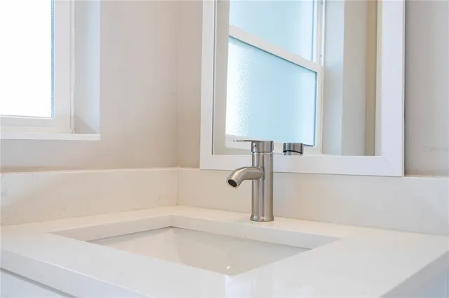 a view of wooden floor and a kitchen