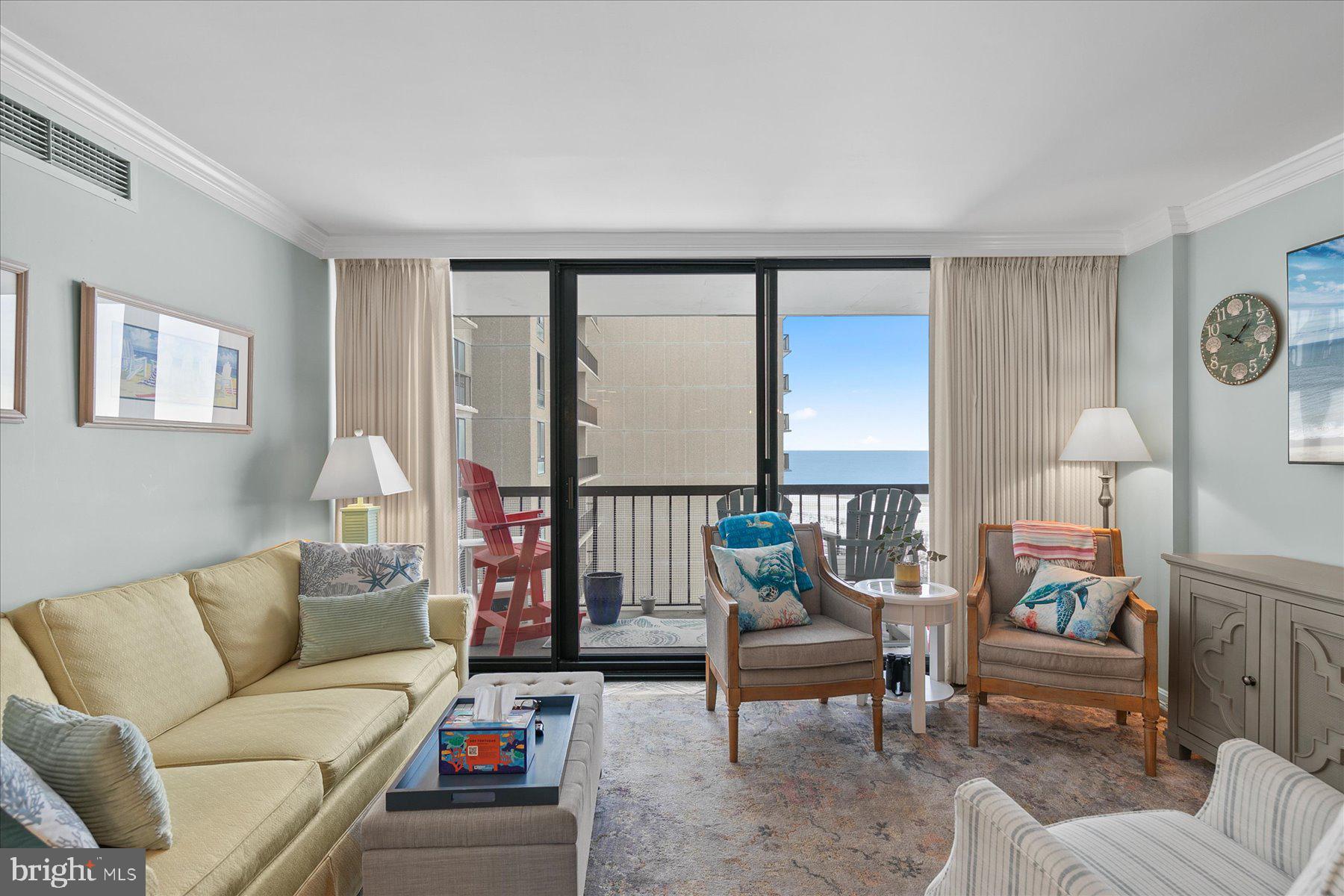 512 Georgetown House, Unit 512 Bethany Beach, DE 19930 - Photo 15 of 28 a living room with furniture and a large window