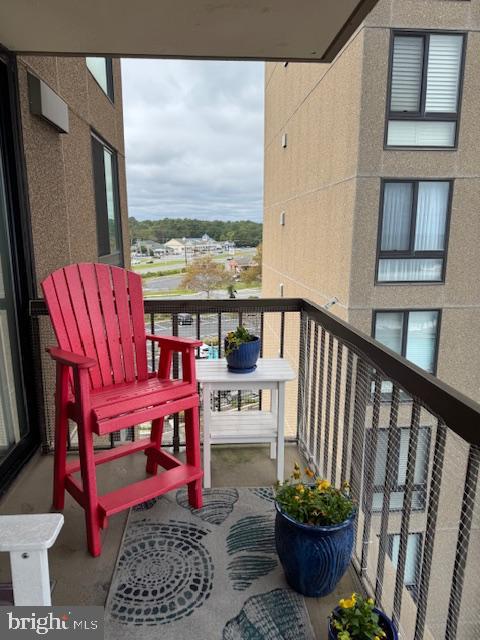 512 Georgetown House, Unit 512 Bethany Beach, DE 19930 - Photo 5 of 28 a view of a chairs and tables in the balcony