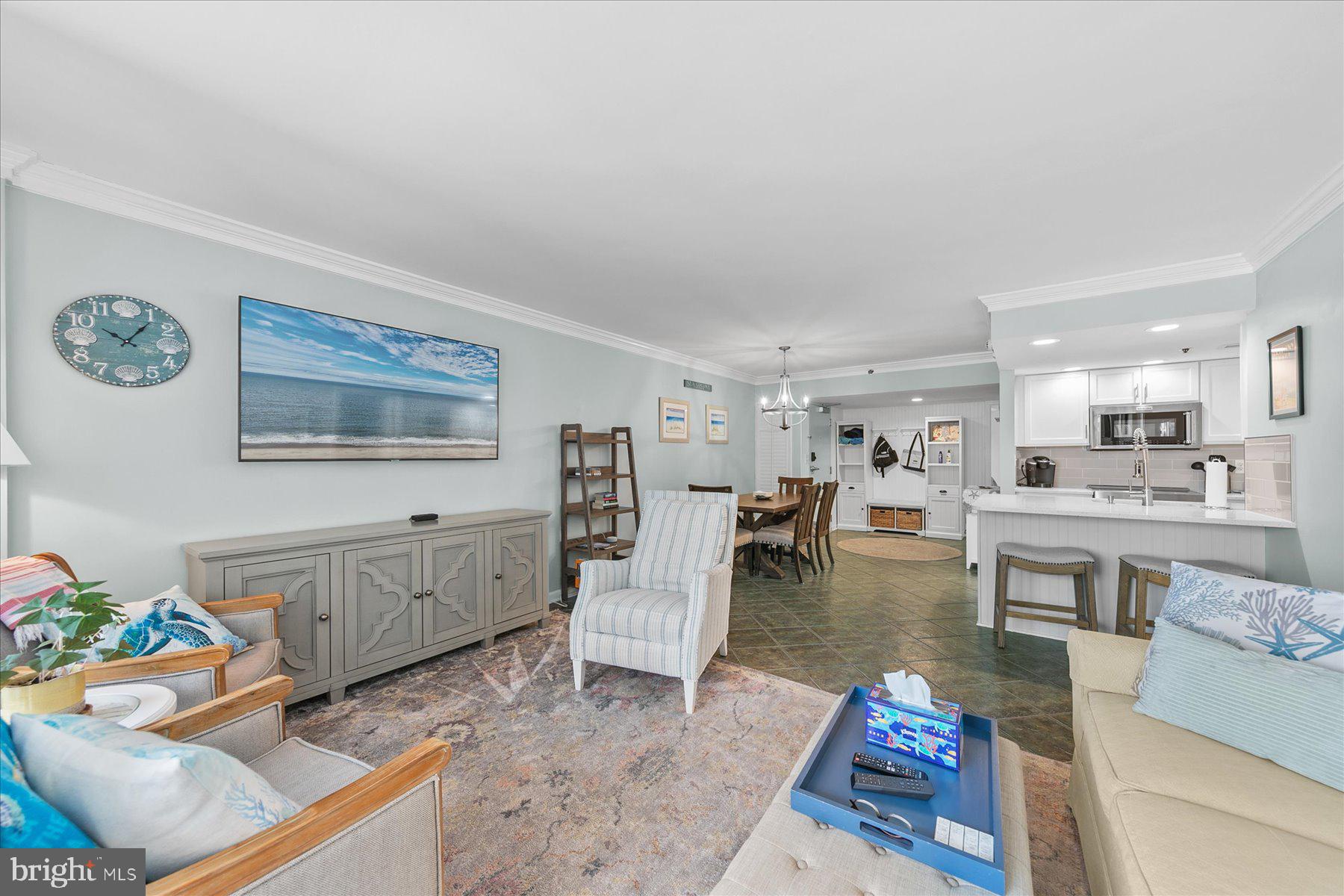 512 Georgetown House, Unit 512 Bethany Beach, DE 19930 - Photo 7 of 28 a living room with furniture and painting on the wall