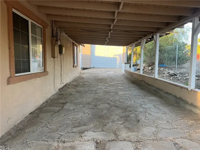 a view of backyard with porch