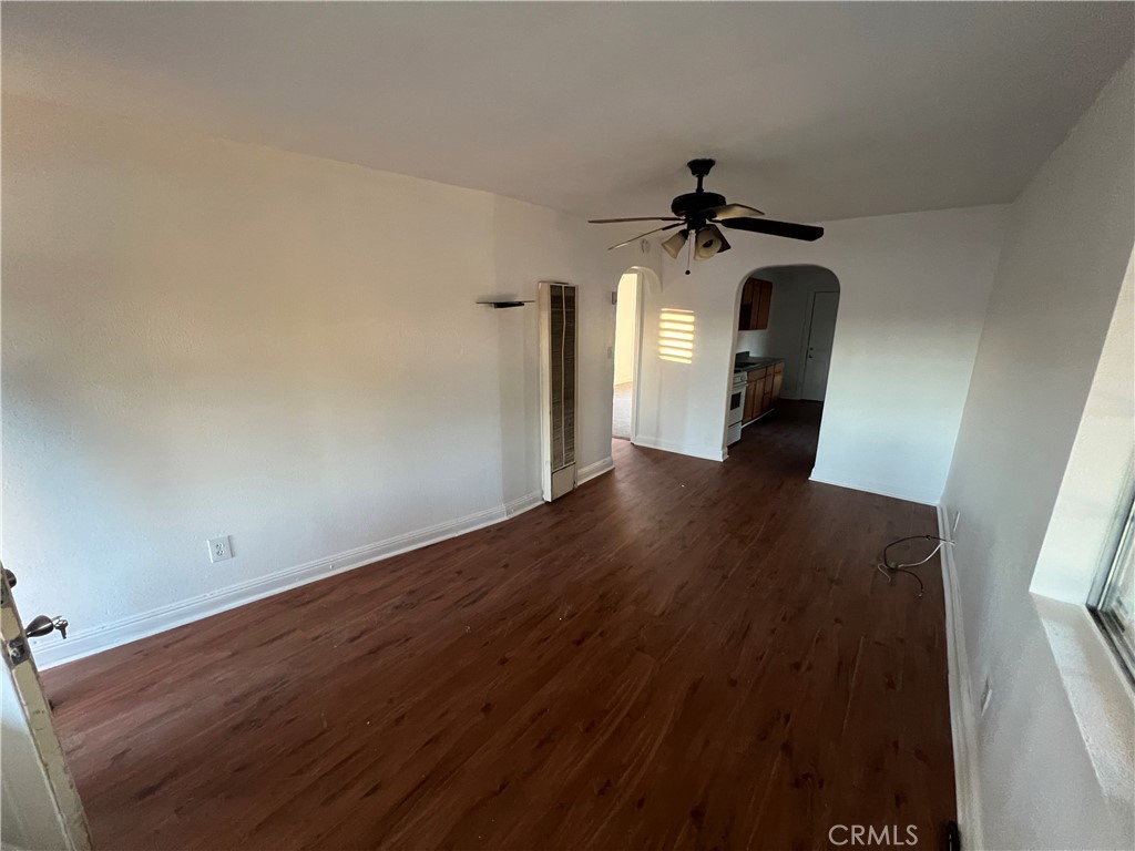 23828 Mt Vernon Place Menifee, CA 92587 - Photo 4 of 10 wooden floor in an empty room with a window
