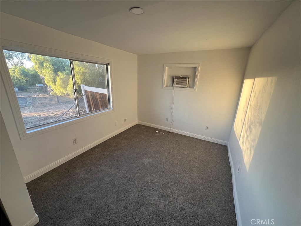 23828 Mt Vernon Place Menifee, CA 92587 - Photo 9 of 10 an empty room with a window