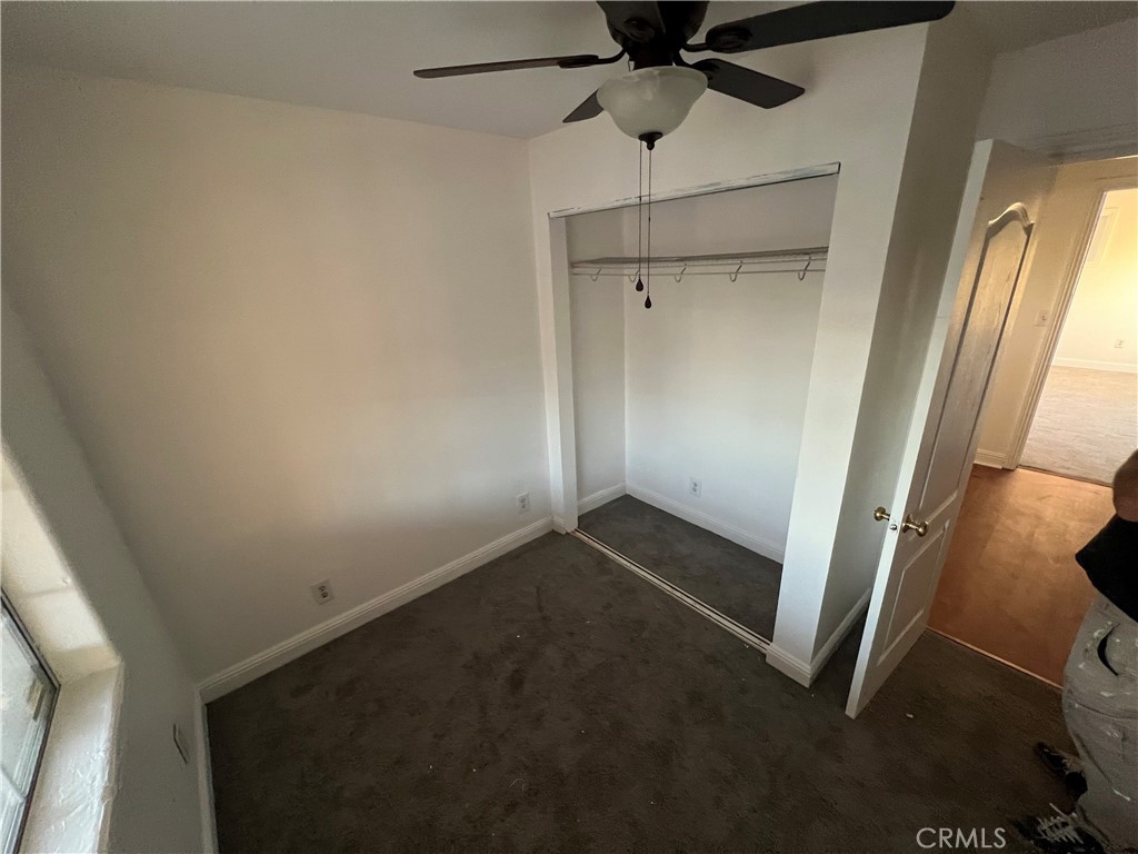 23828 Mt Vernon Place Menifee, CA 92587 - Photo 10 of 10 an empty room with a ceiling fan and window