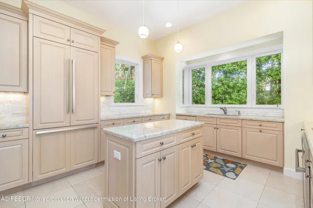 a spacious bathroom with a sink a mirror and a shower