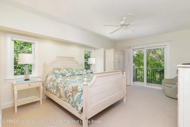 a building outdoor space with patio furniture and garden