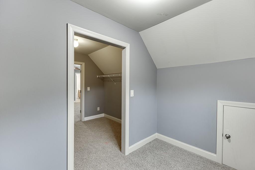 940 Chateau Forest Road Hoschton, GA 30548 - Photo 54 of 87 a view of an empty room with closet and a bathroom