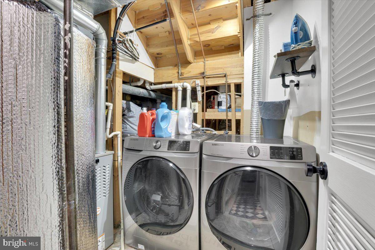 10700 Winfield Loop Manassas, VA 20109 - Photo 14 of 31 a utility room with dryer and washer