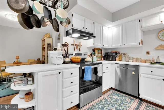 a kitchen with stainless steel appliances cabinets and a counter top