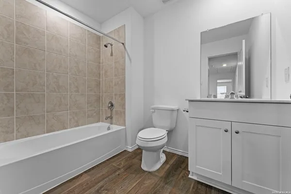 a bathroom with a toilet sink and a bathtub