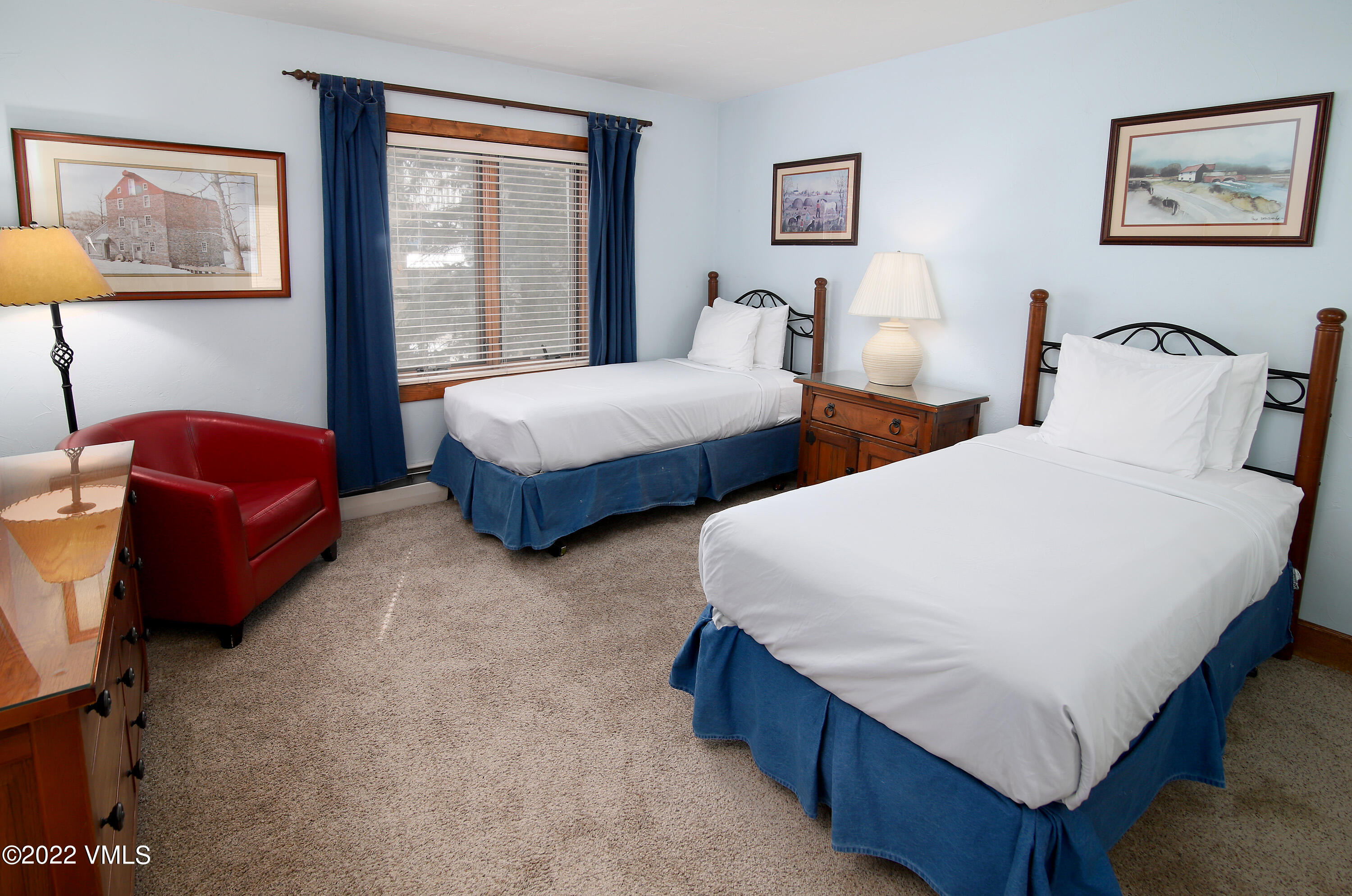 548 South Frontage Road West, Unit 105 Vail, CO 81657 - Photo 11 of 19 a bedroom with two beds and a couch