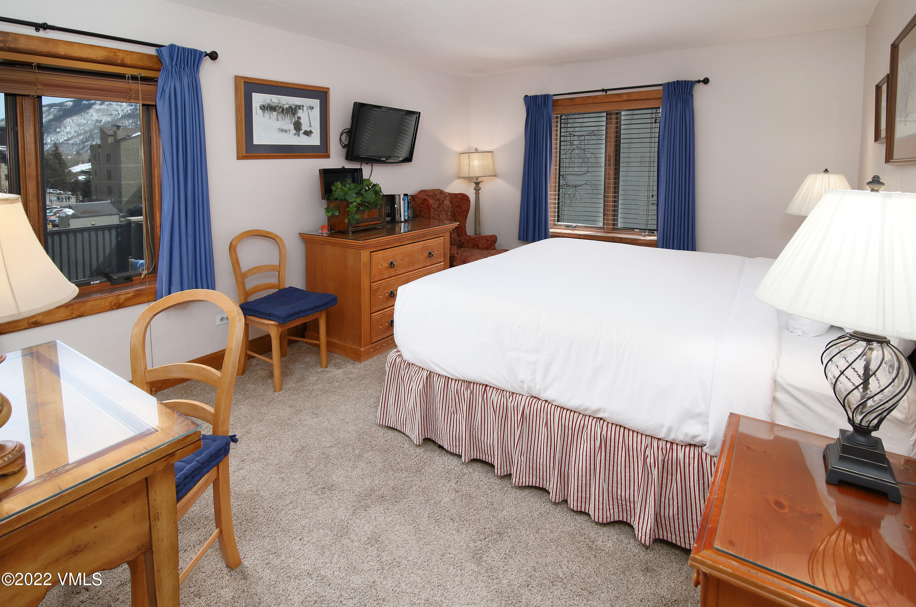 548 South Frontage Road West, Unit 105 Vail, CO 81657 - Photo 13 of 19 a bedroom with furniture and wooden floor