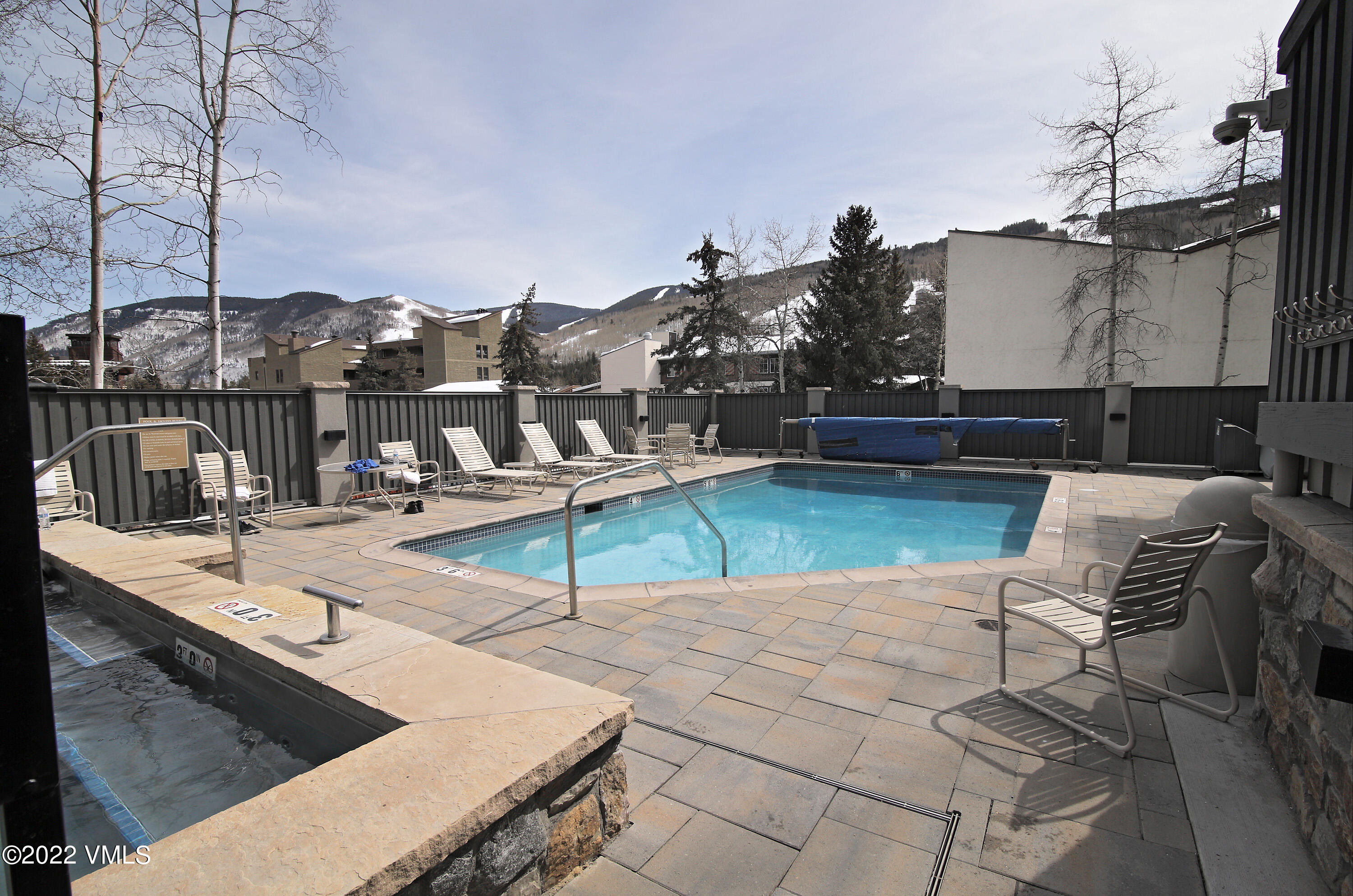 548 South Frontage Road West, Unit 105 Vail, CO 81657 - Photo 16 of 19 a view of a swimming pool with a lounge chairs