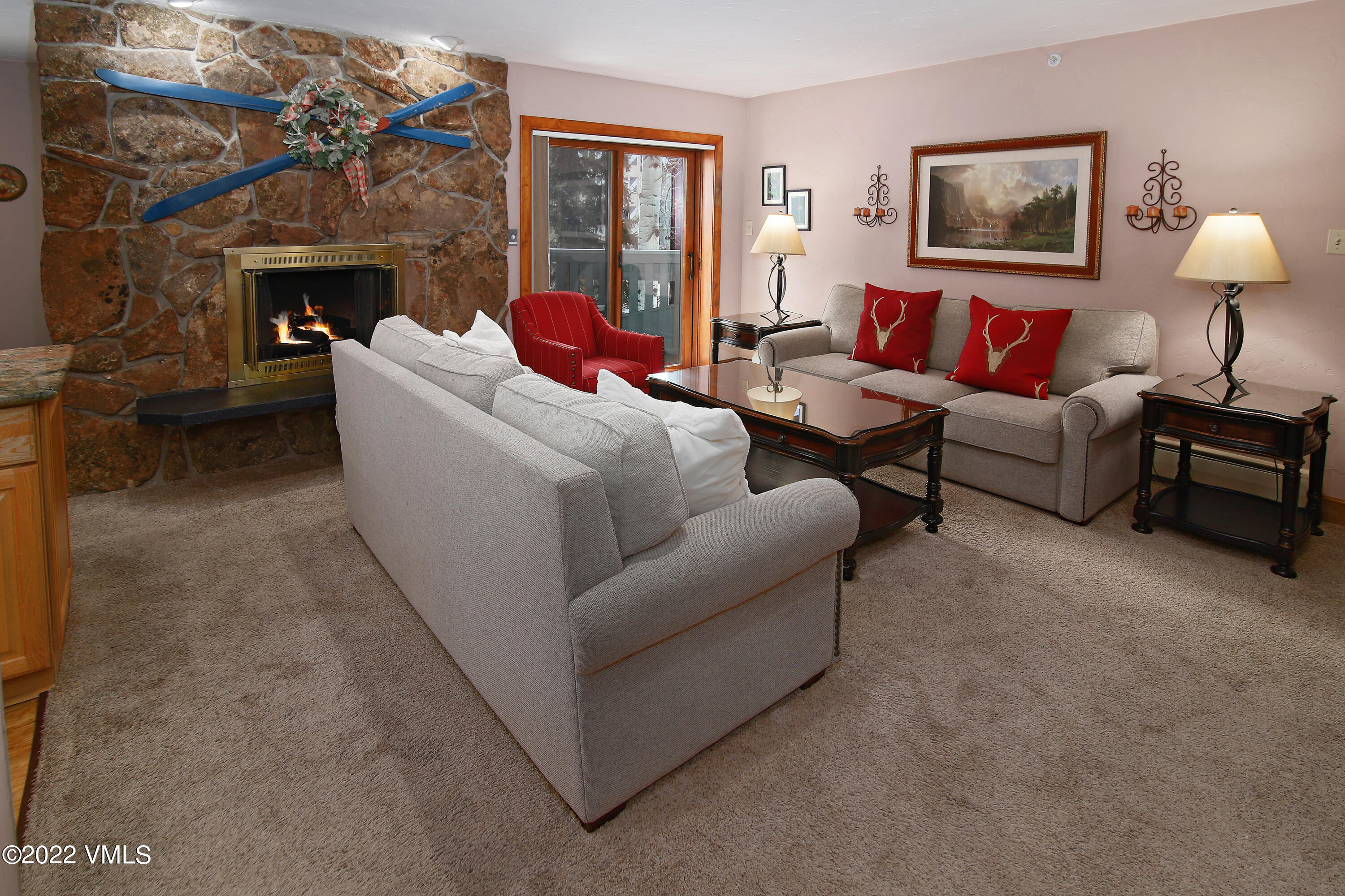 548 South Frontage Road West, Unit 105 Vail, CO 81657 - Photo 2 of 19 a living room with furniture and a fireplace