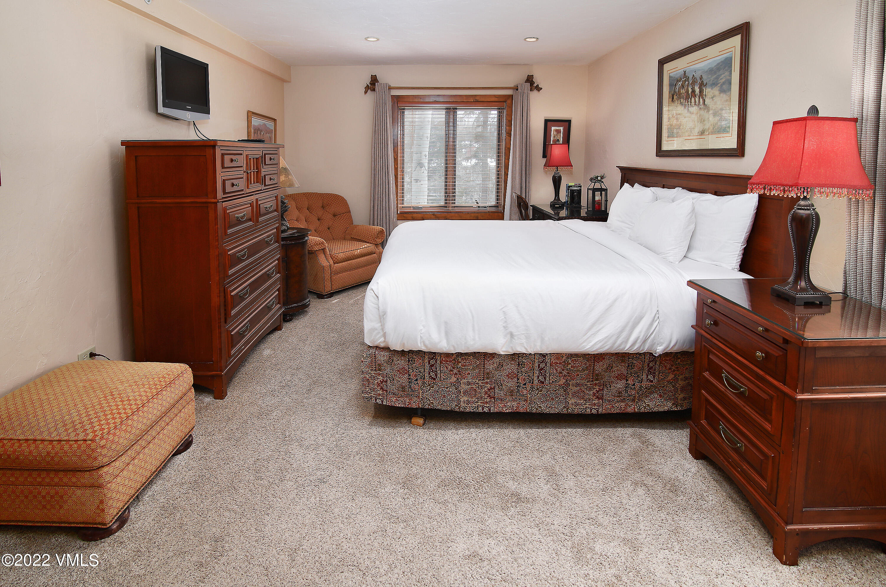 548 South Frontage Road West, Unit 105 Vail, CO 81657 - Photo 9 of 19 a bedroom with a bed and wooden floor