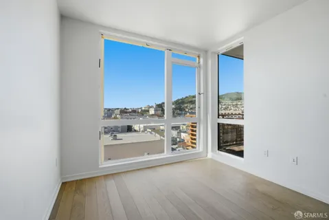 a view of a room that has a bed in it