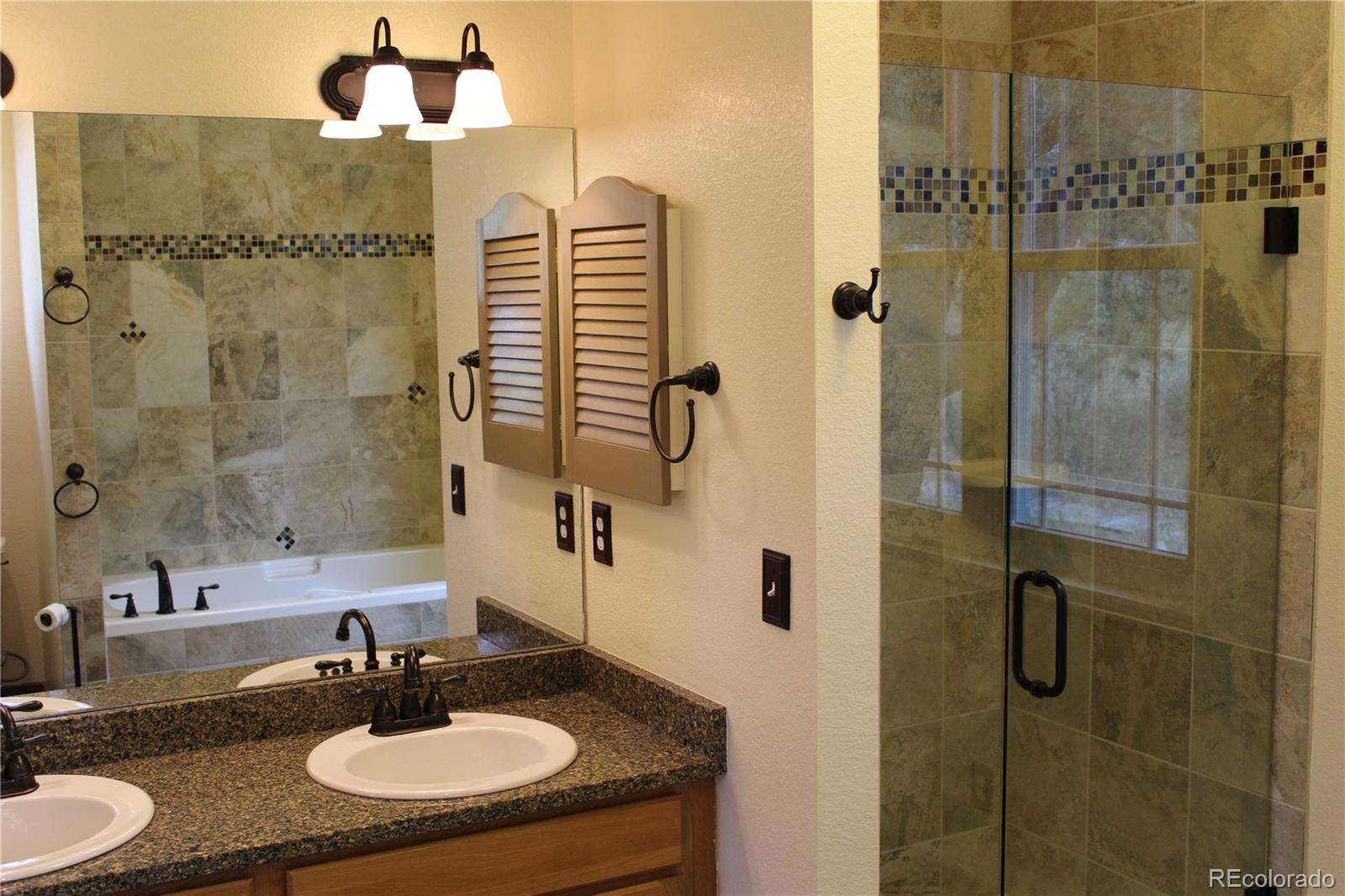 37622 Sable Ridge Road Elizabeth, CO 80107 - Photo 14 of 32 a bathroom with a sink and a mirror