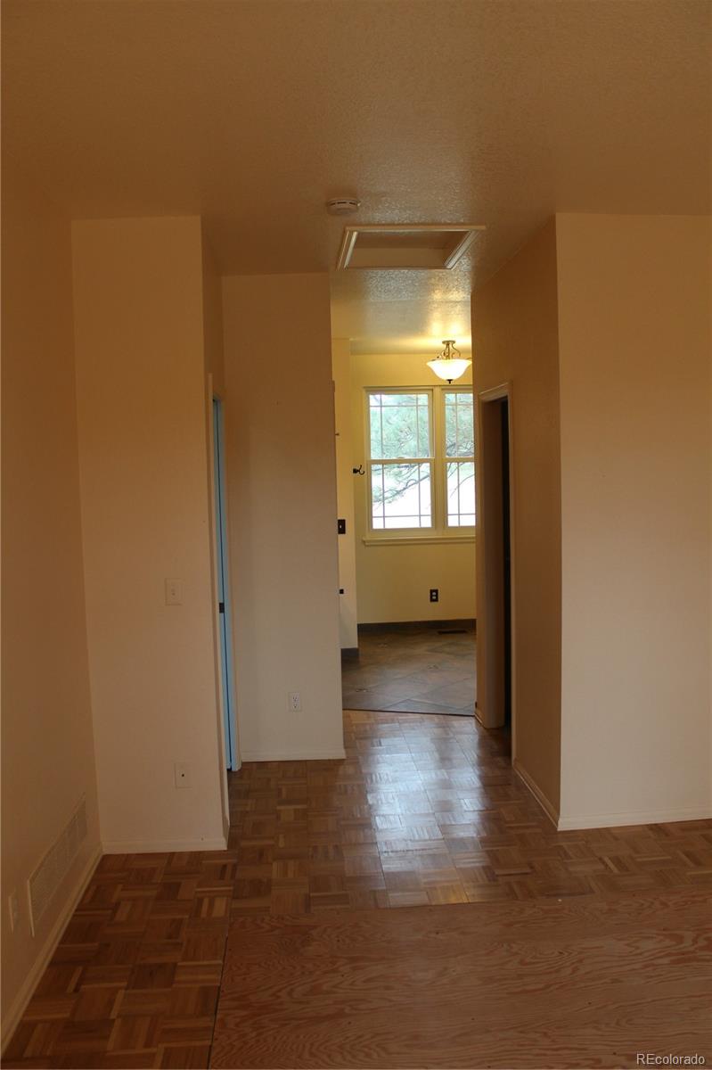 37622 Sable Ridge Road Elizabeth, CO 80107 - Photo 16 of 32 a view of a room with wooden floor and windows