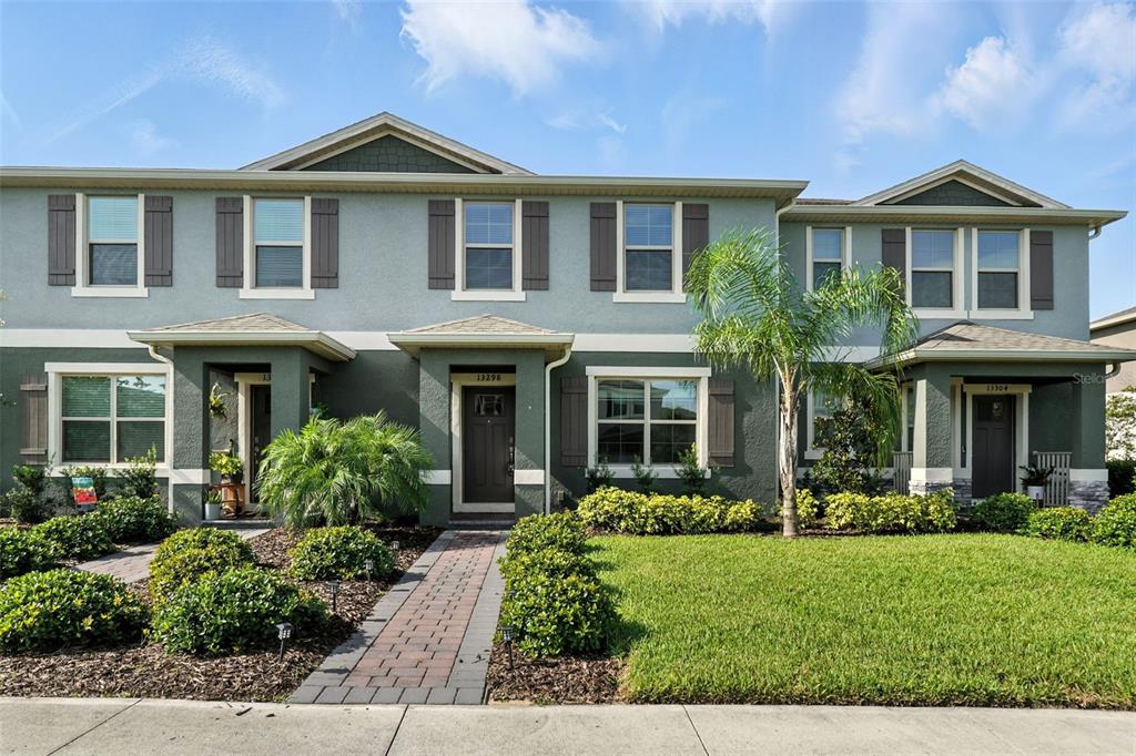 13298 Pontoon Road Winter Garden, FL 34787 - Photo 1 of 1 a front view of a house with garden