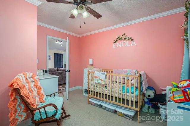 a bedroom with furniture and a chandelier