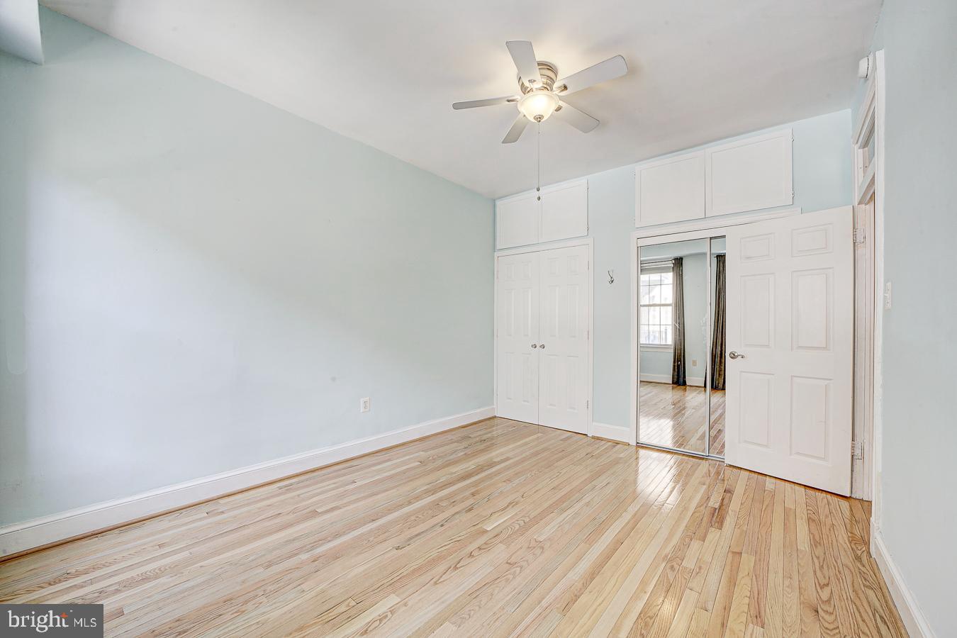 1401 Columbia Road Northwest, Unit 219 Washington, DC 20009 - Photo 18 of 33 wooden floor in an empty room with a window