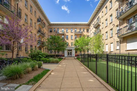 a view of a building with a yard