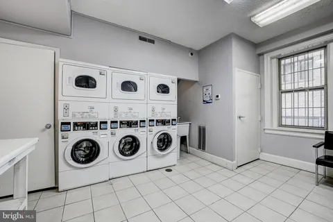 a view of a hallway with entryway and furniture