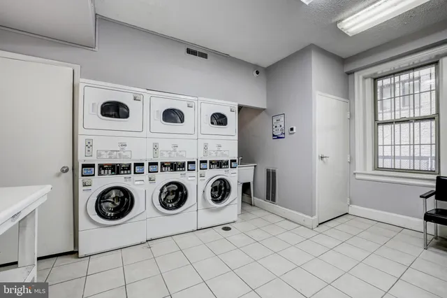a view of a hallway with entryway and furniture