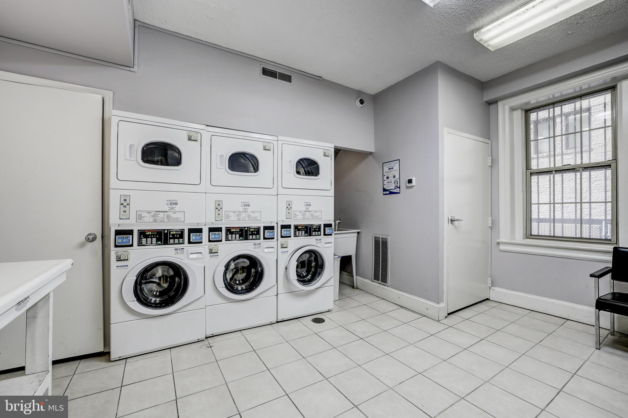 1401 Columbia Road Northwest, Unit 219 Washington, DC 20009 - Photo 25 of 33 a utility room with dryer and washer