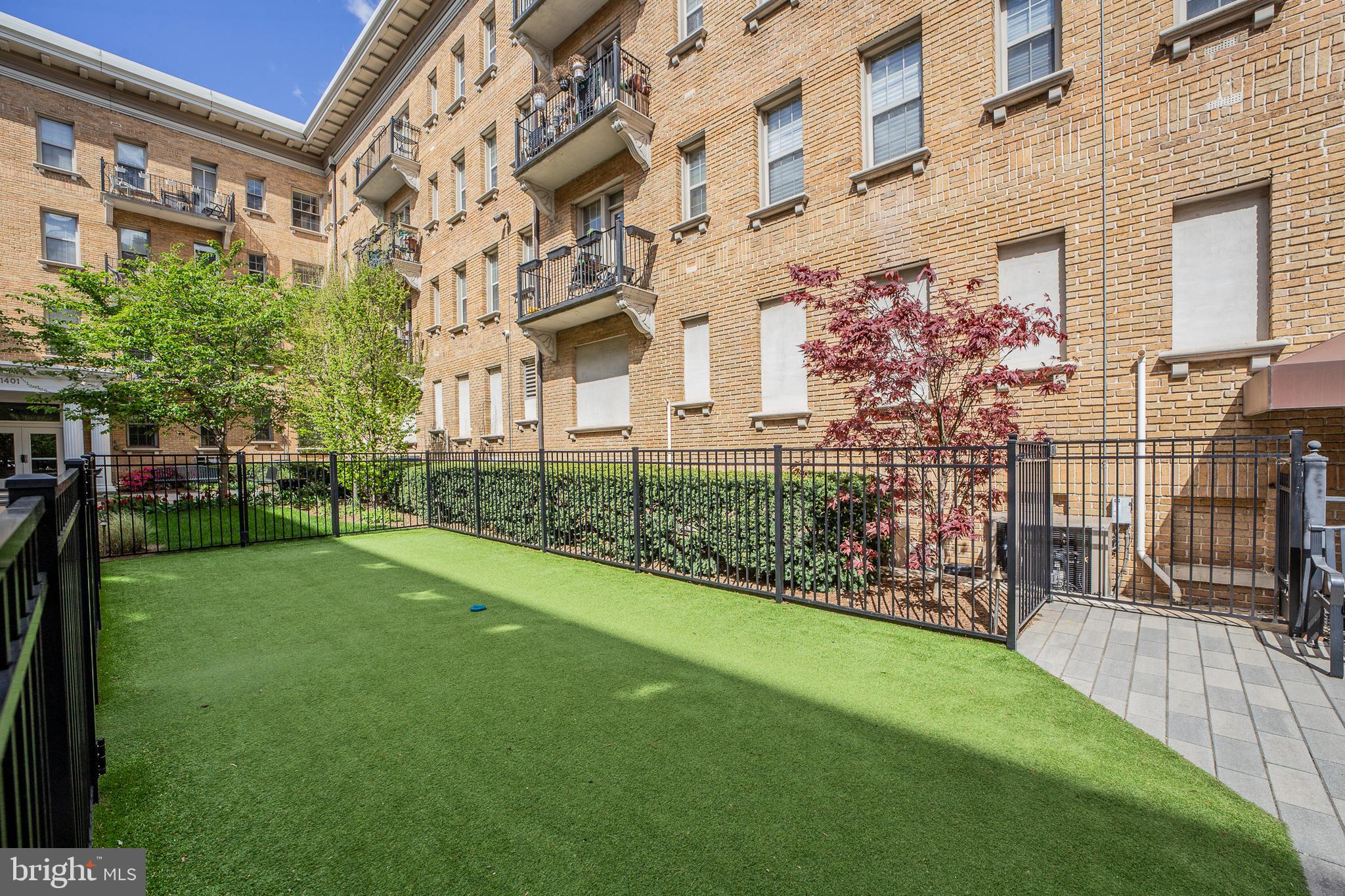 1401 Columbia Road Northwest, Unit 219 Washington, DC 20009 - Photo 29 of 33 front view of a house with a yard