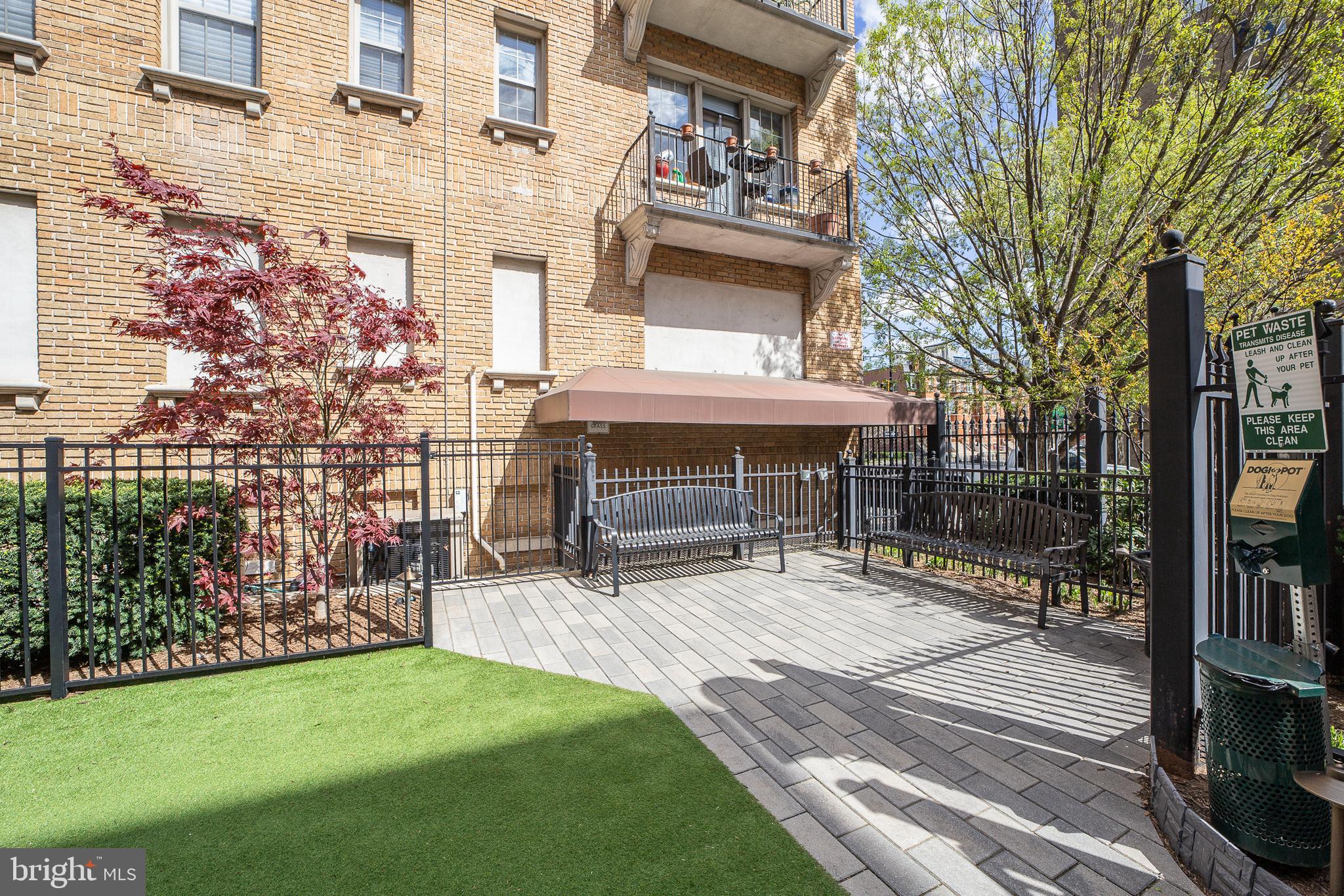 1401 Columbia Road Northwest, Unit 219 Washington, DC 20009 - Photo 30 of 33 a view of a patio with table and chairs and potted plants