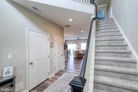 a kitchen with stainless steel appliances granite countertop a refrigerator stove microwave and sink