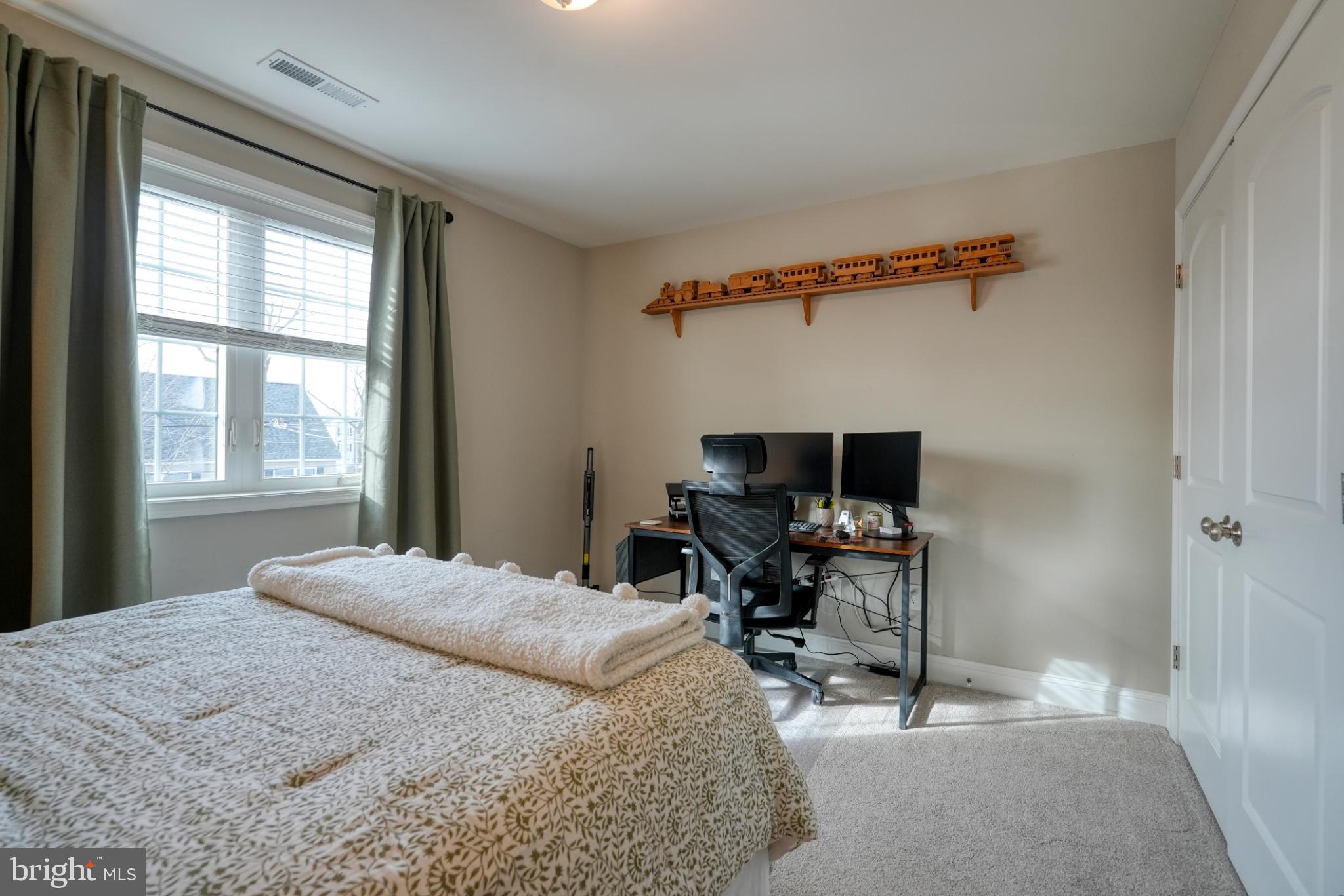 813 5th Avenue Croydon, PA 19021 - Photo 35 of 58 Cozy workspace in a serene bedroom setting.