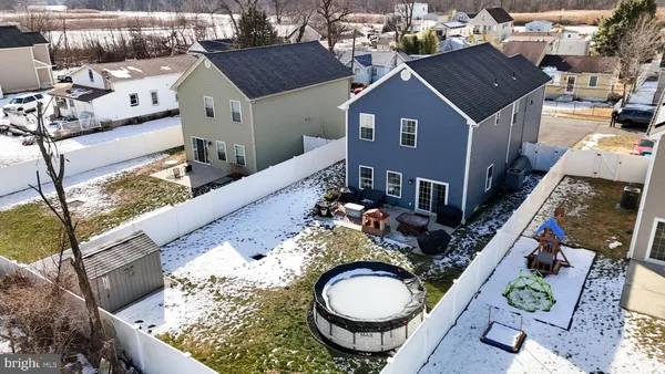 a aerial view of a house with a yard