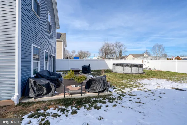 a view of a backyard with sitting area
