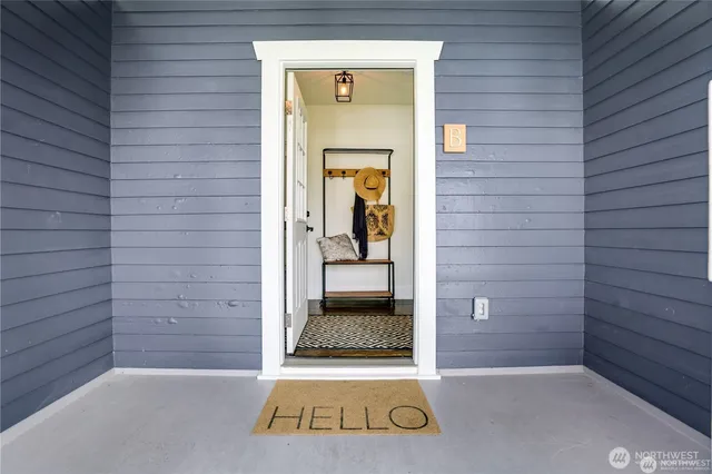 a view of a hallway with wooden walls