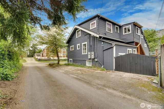 a view of a house with swimming pool yard and front view of a house