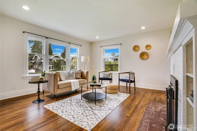 a living room with furniture rug and window