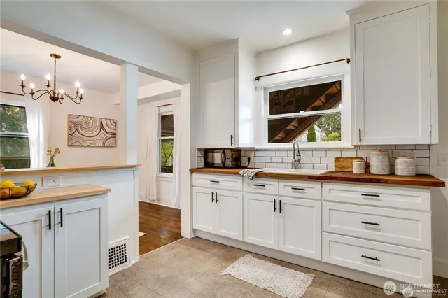 a spacious bathroom with a granite countertop sink a mirror and a