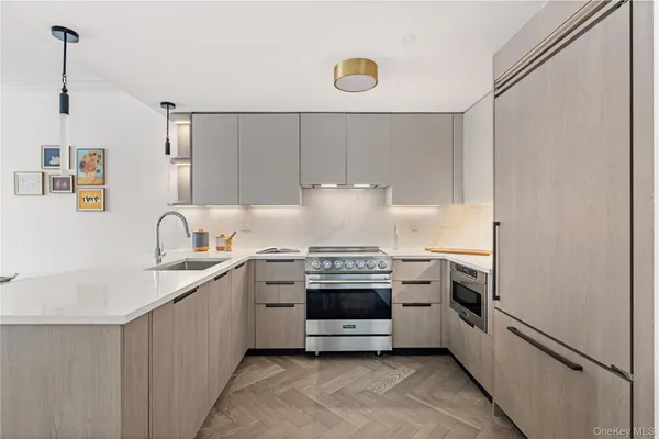 a kitchen with stainless steel appliances granite countertop a stove and a sink